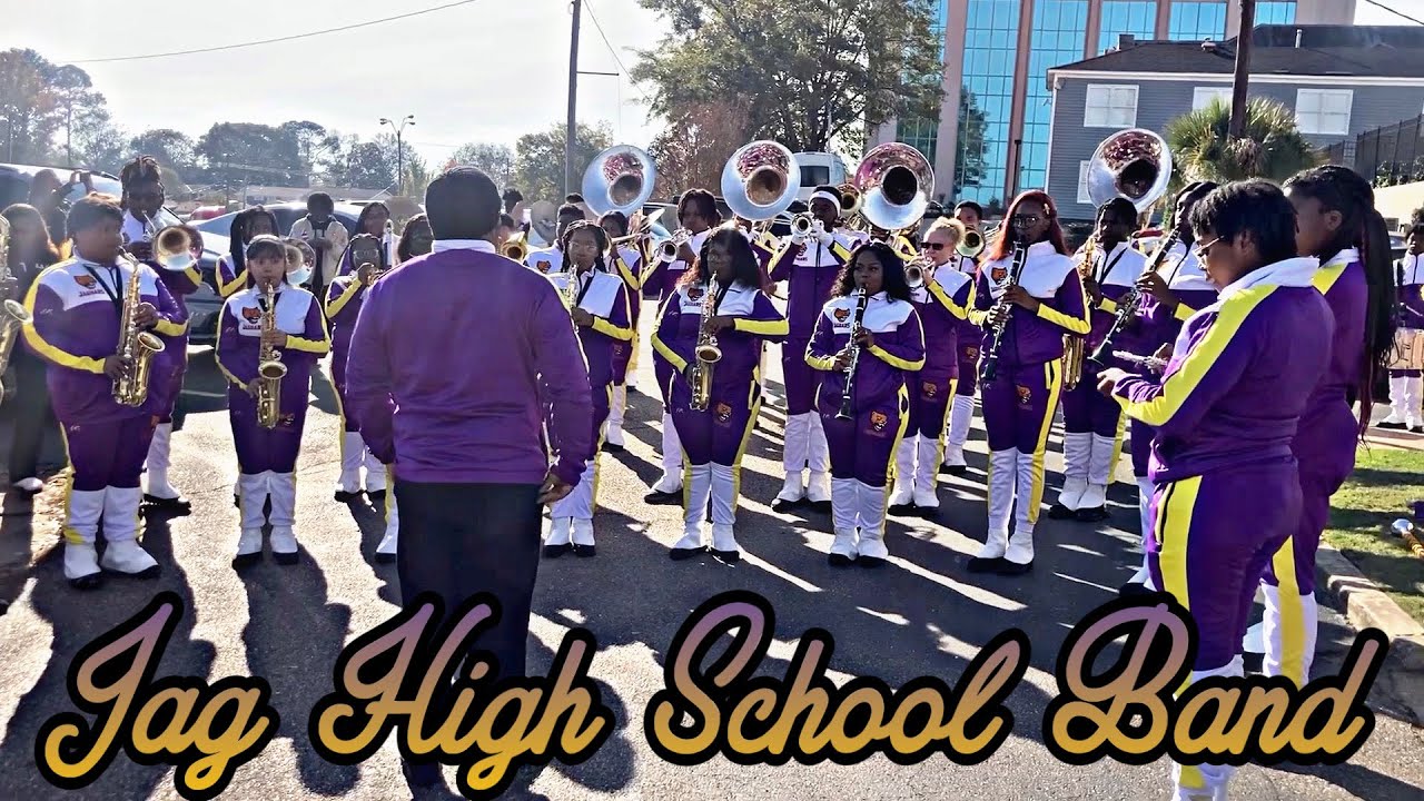 High school marching band performing in a parade.